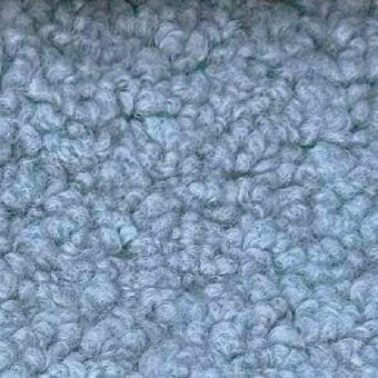 Lamby fabric texture, muted gray-blue, densely packed rounded forms with darker gray lines, matte finish, egoitaliano sample.